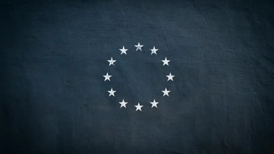 A ring of EU flag stars on a dark blue background, symbolizing the EU AI Act’s Article 50 transparency and AI watermark rules